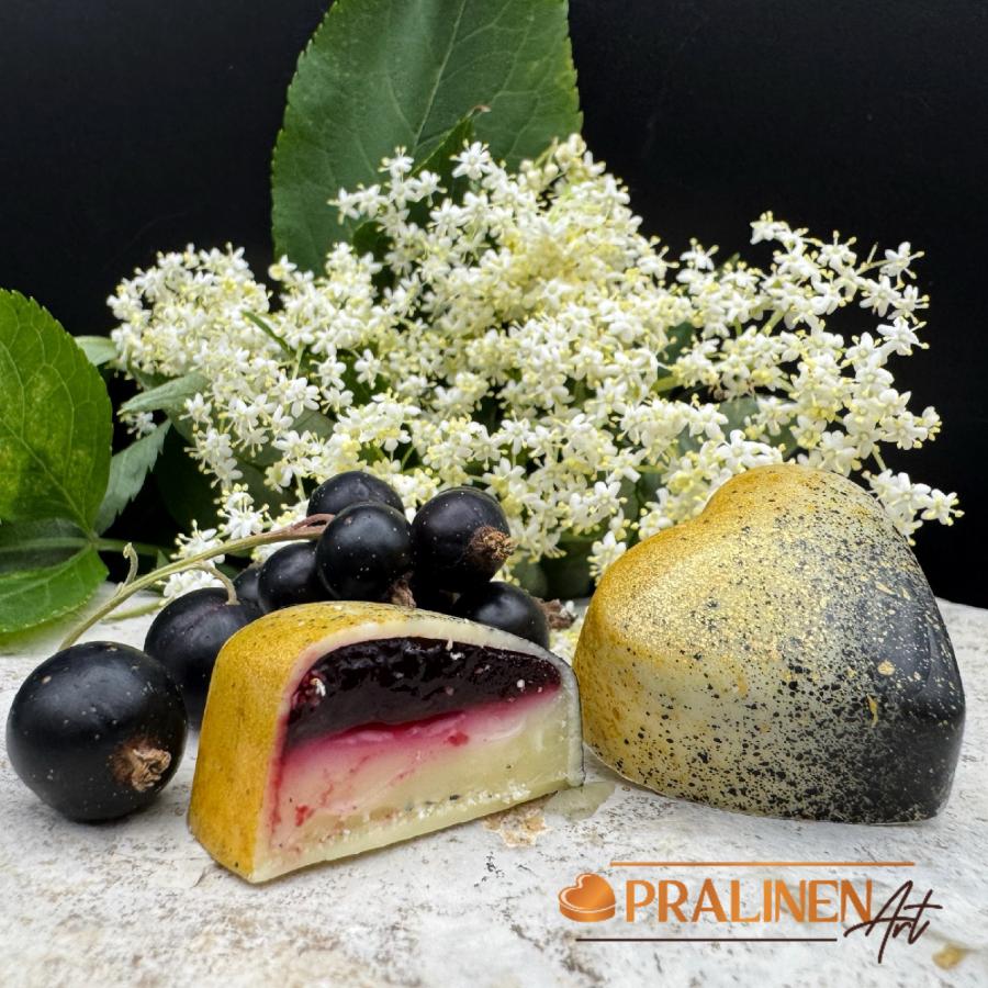 Black Hugo Pralinen, weiße Schokolade mit Holunderblüte & Johannisbeere | 4 Stück